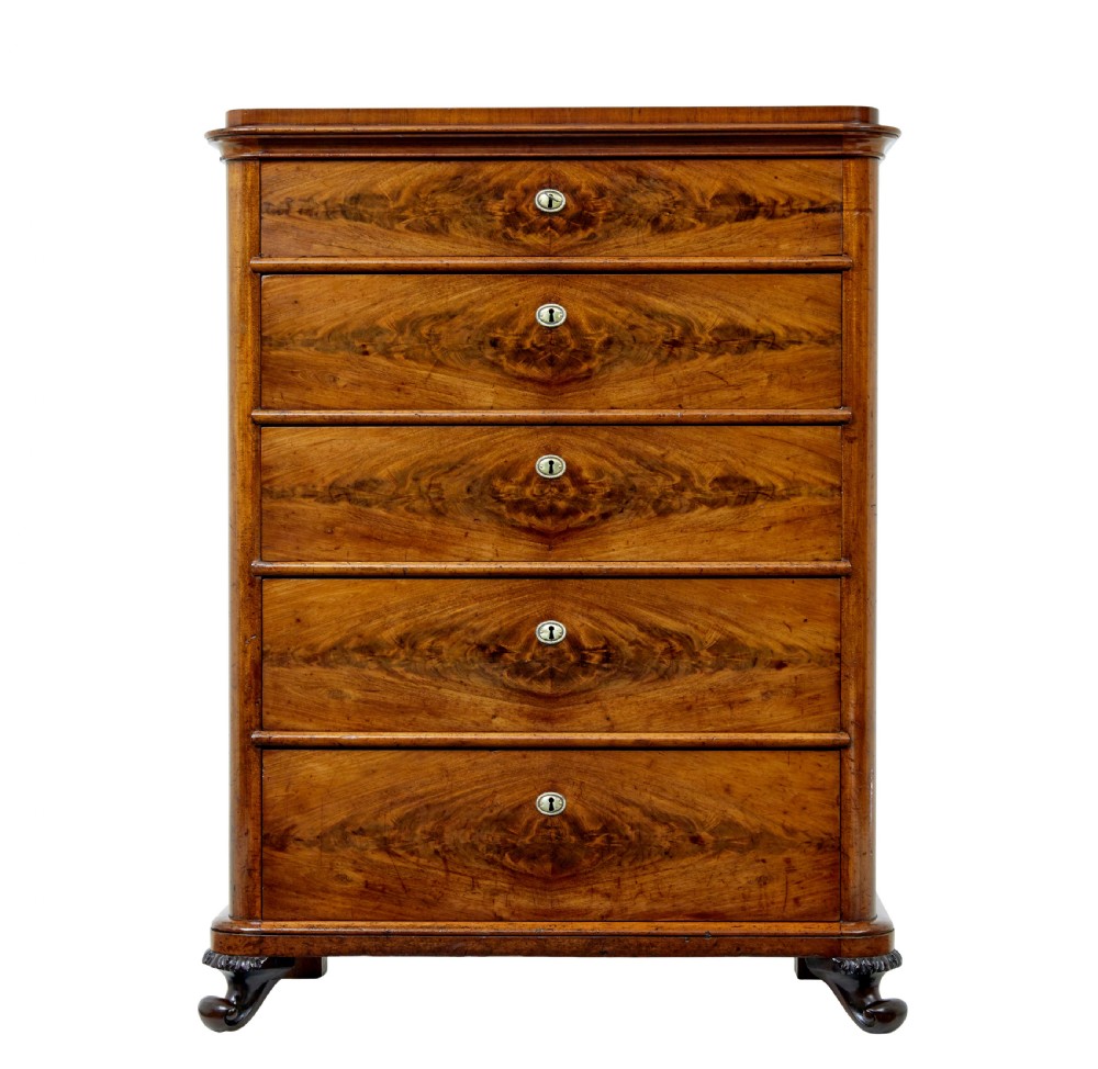 A nineteenth-century Swedish mahogany chest of drawers featuring five stacked drawers with book-matched veneer and brass keyhole escutcheons. View III