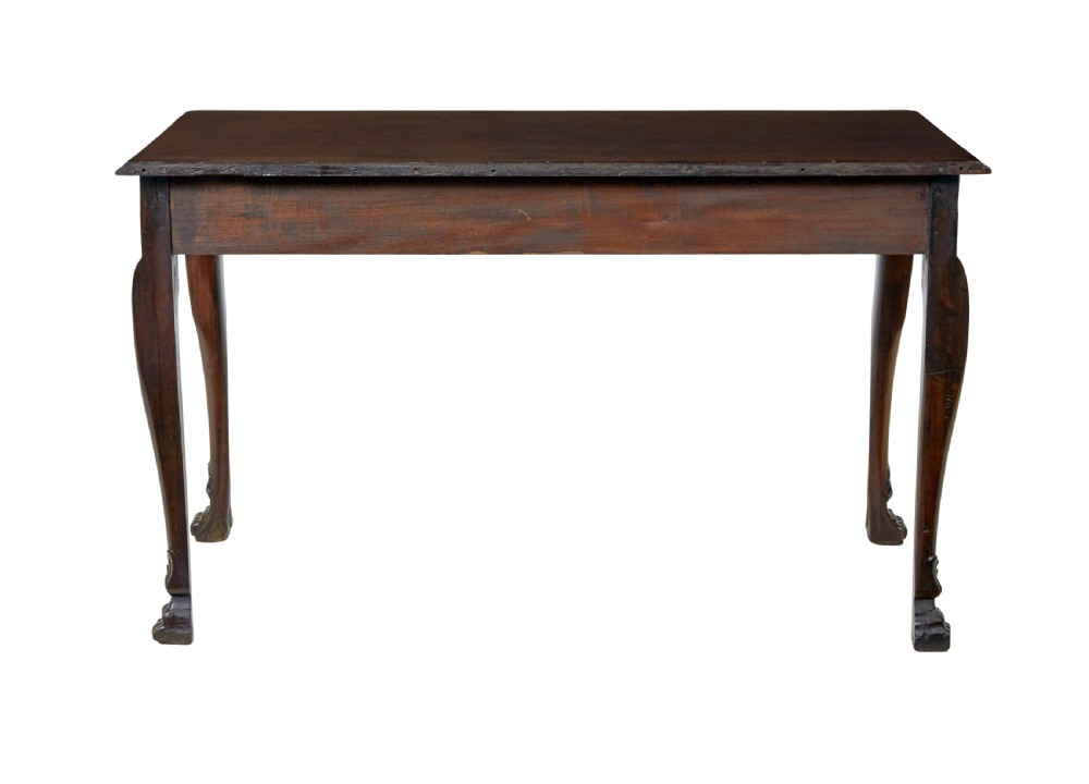 An early nineteenth-century Irish mahogany serving table with a carved central shell motif, scalloped frieze, cabriole legs, and carved feet. View IV
