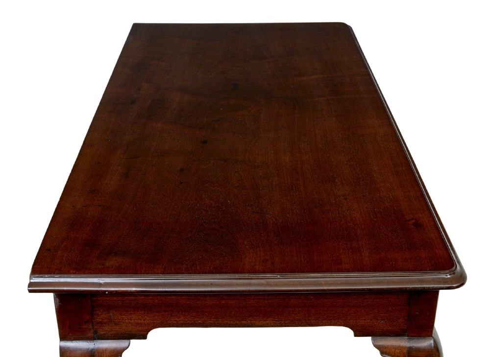 An early nineteenth-century Irish mahogany serving table with a carved central shell motif, scalloped frieze, cabriole legs, and carved feet. View VI
