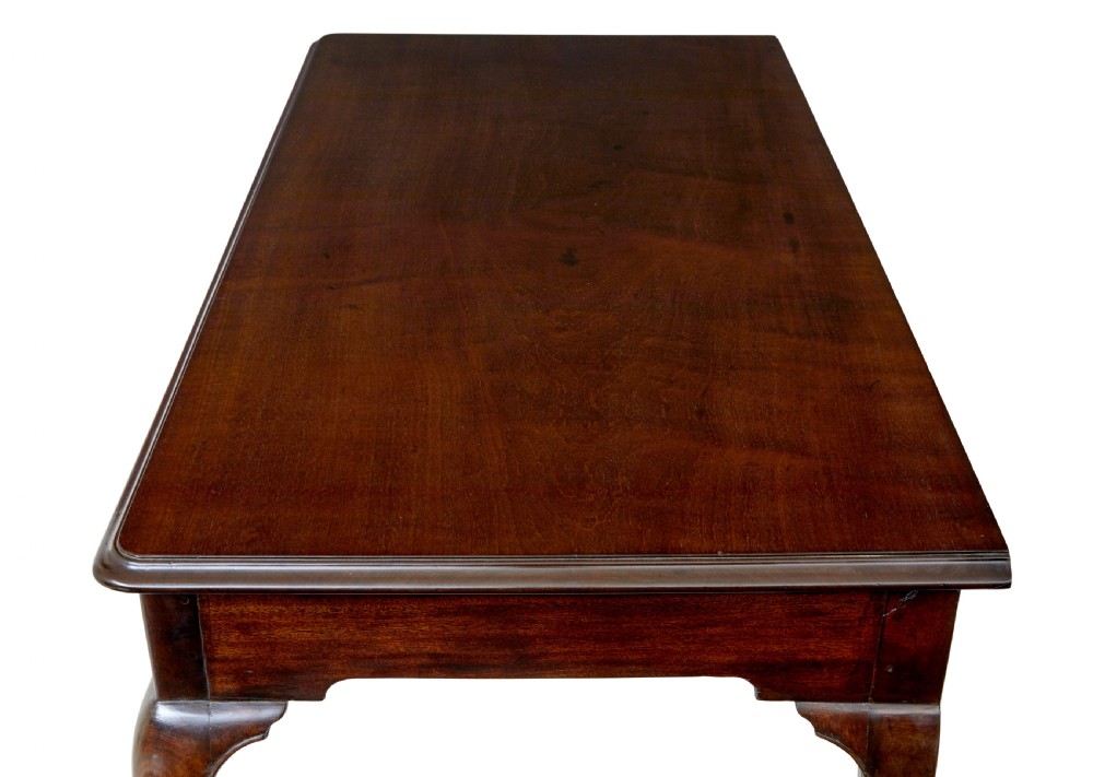 An early nineteenth-century Irish mahogany serving table with a carved central shell motif, scalloped frieze, cabriole legs, and carved feet. View VII