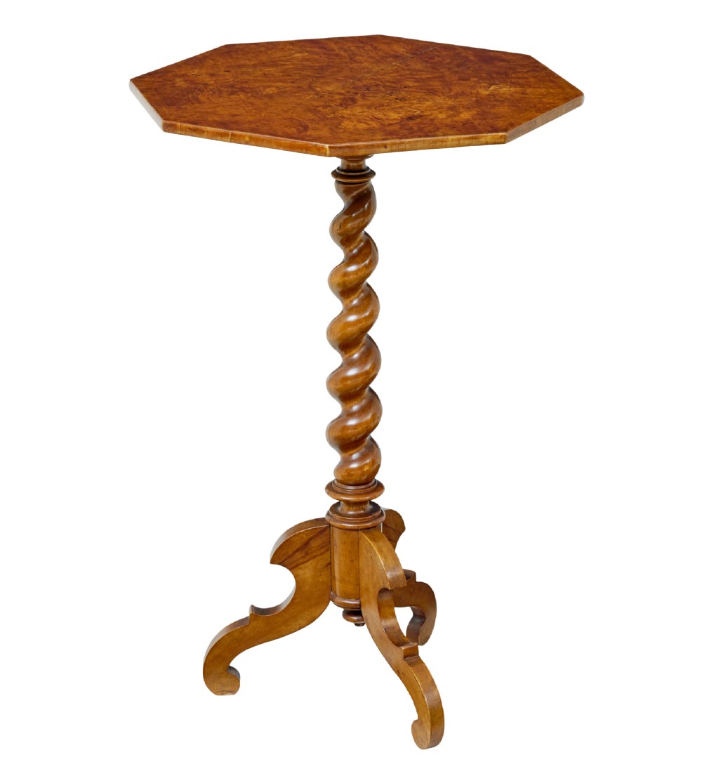 A 19th-century octagonal side table crafted from figured burr elm with a barley twist central column and tripod scrolled feet.