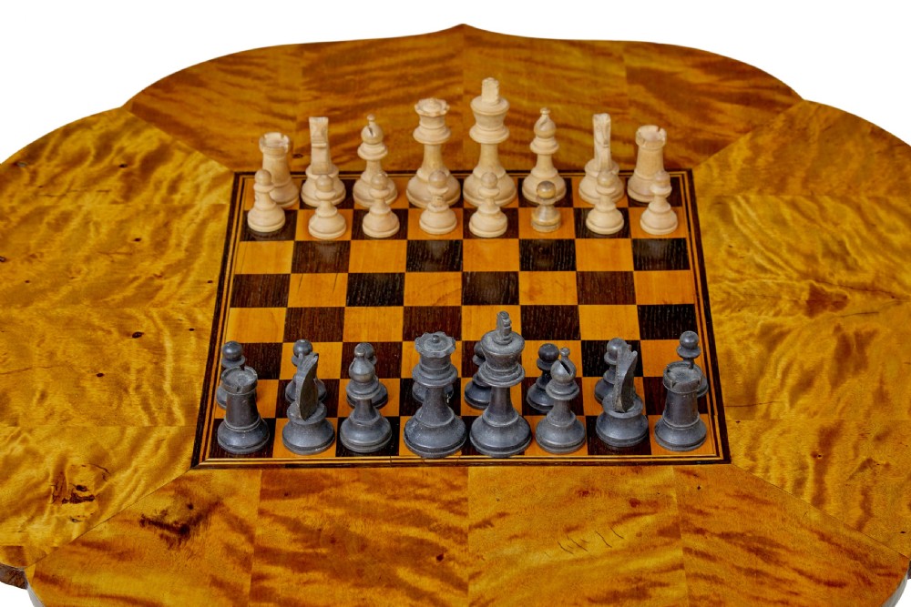 A 19th-century Swedish games table crafted from birch timber, featuring a lobed top with an inlaid wooden chessboard set upon a turned pedestal and tripod legs. View III