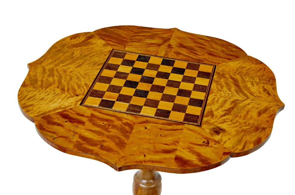 A 19th-century Swedish games table crafted from birch timber, featuring a lobed top with an inlaid wooden chessboard set upon a turned pedestal and tripod legs. View IV