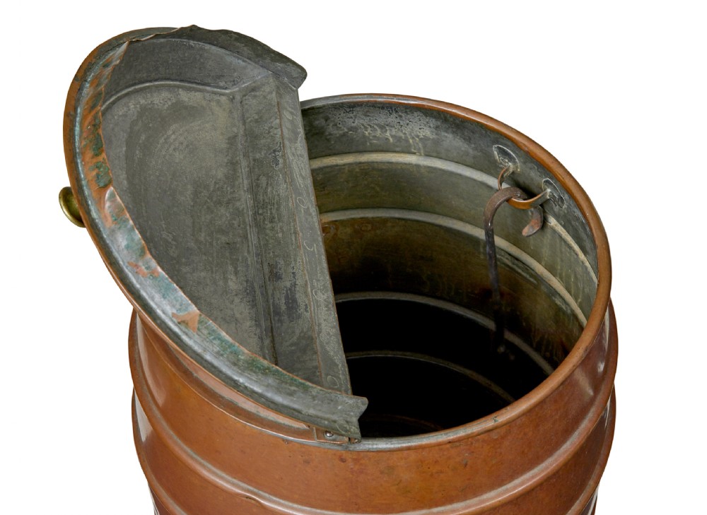 A 19th-century copper water barrel with horizontal raised bands, cast brass drop handles, a flared base, and a fitted copper lid with a brass knob. View VII