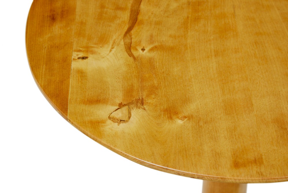A pair of 19th-century Swedish light birch side tables featuring circular tops supported by turned central pedestals and tripod legs. View VI