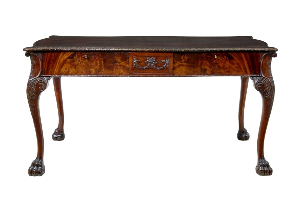 A mid-19th-century mahogany writing desk in the Chippendale style featuring cabriole legs ending in ball and claw feet, with carved knee details and frieze drawers. View III