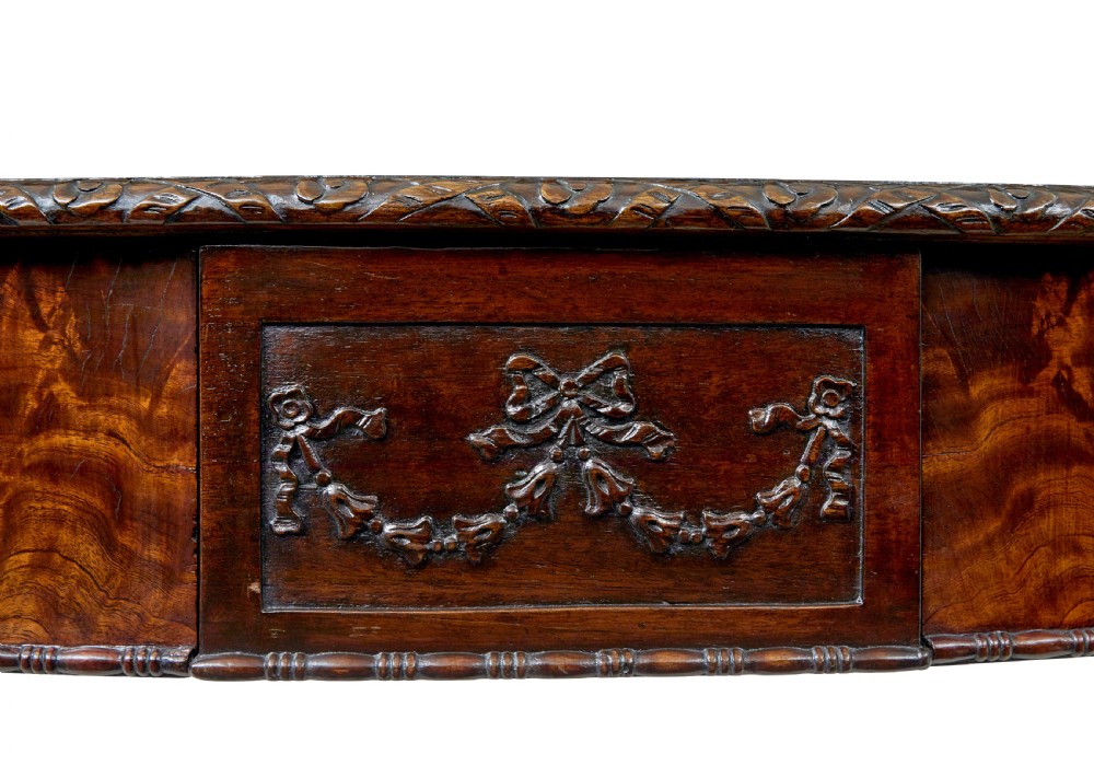 A mid-19th-century mahogany writing desk in the Chippendale style featuring cabriole legs ending in ball and claw feet, with carved knee details and frieze drawers. View VIII