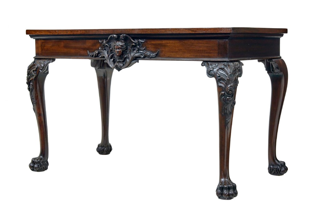 A 19th-century dark mahogany serving table featuring carved cabriole legs, claw feet, and a carved central apron mask. View II
