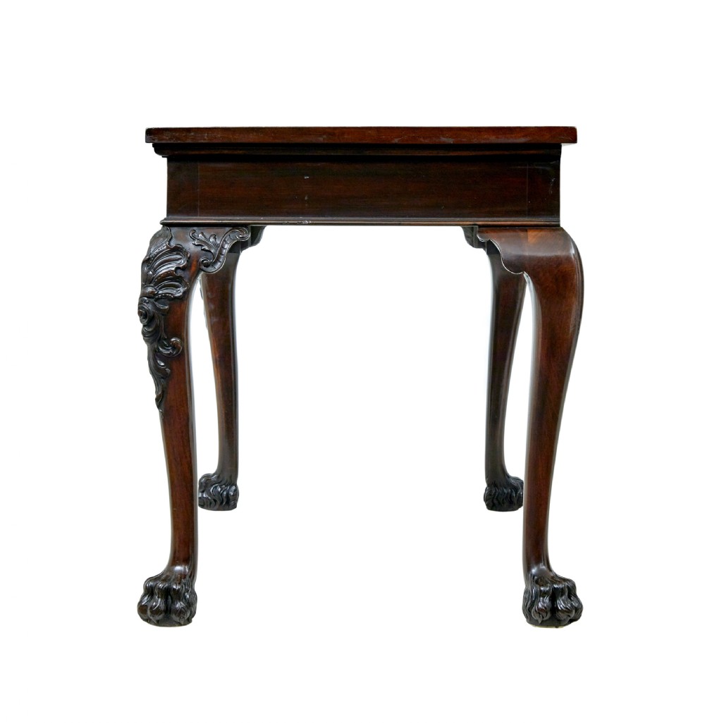 A 19th-century dark mahogany serving table featuring carved cabriole legs, claw feet, and a carved central apron mask. View IV