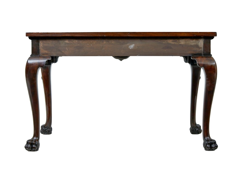 A 19th-century dark mahogany serving table featuring carved cabriole legs, claw feet, and a carved central apron mask. View V