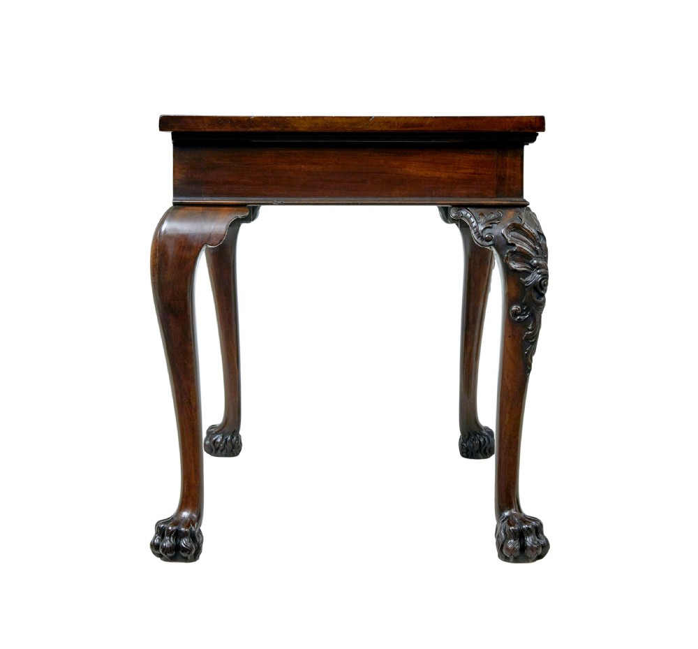 A 19th-century dark mahogany serving table featuring carved cabriole legs, claw feet, and a carved central apron mask. View VI