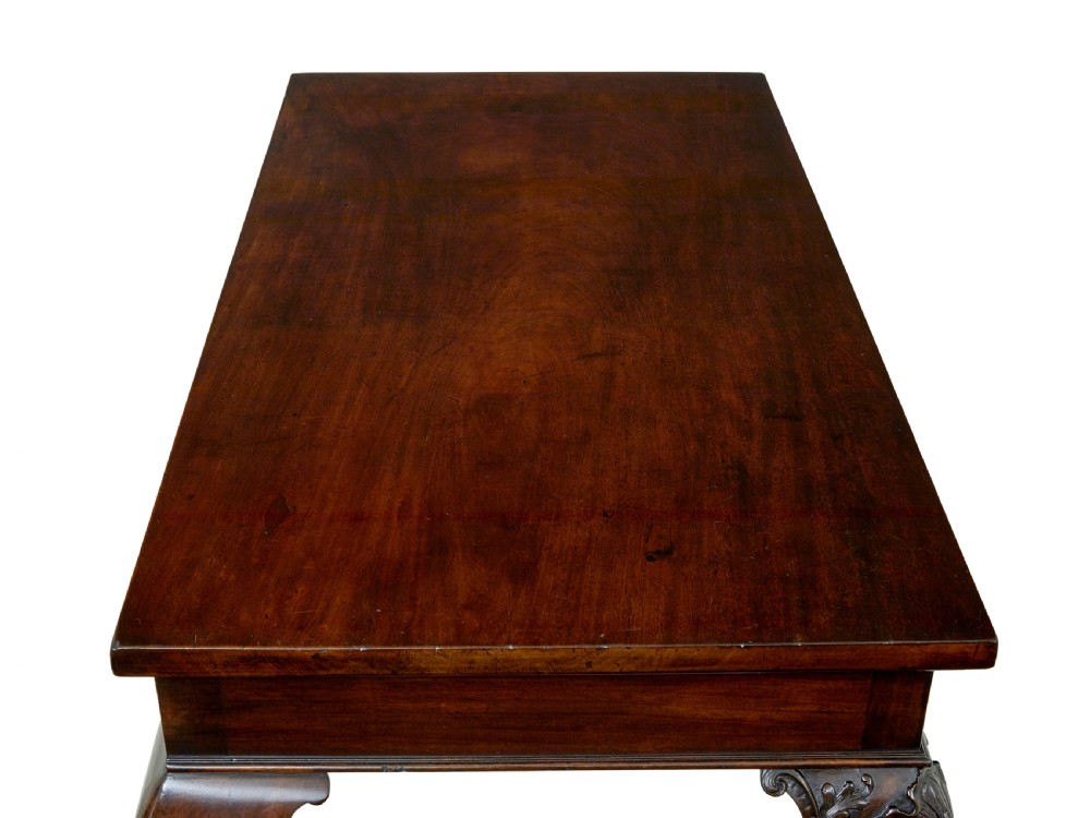 A 19th-century dark mahogany serving table featuring carved cabriole legs, claw feet, and a carved central apron mask. View XI