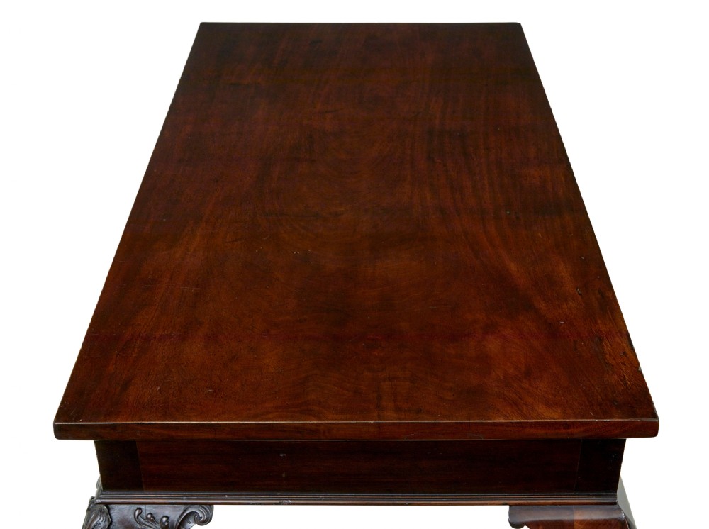 A 19th-century dark mahogany serving table featuring carved cabriole legs, claw feet, and a carved central apron mask. View XIV