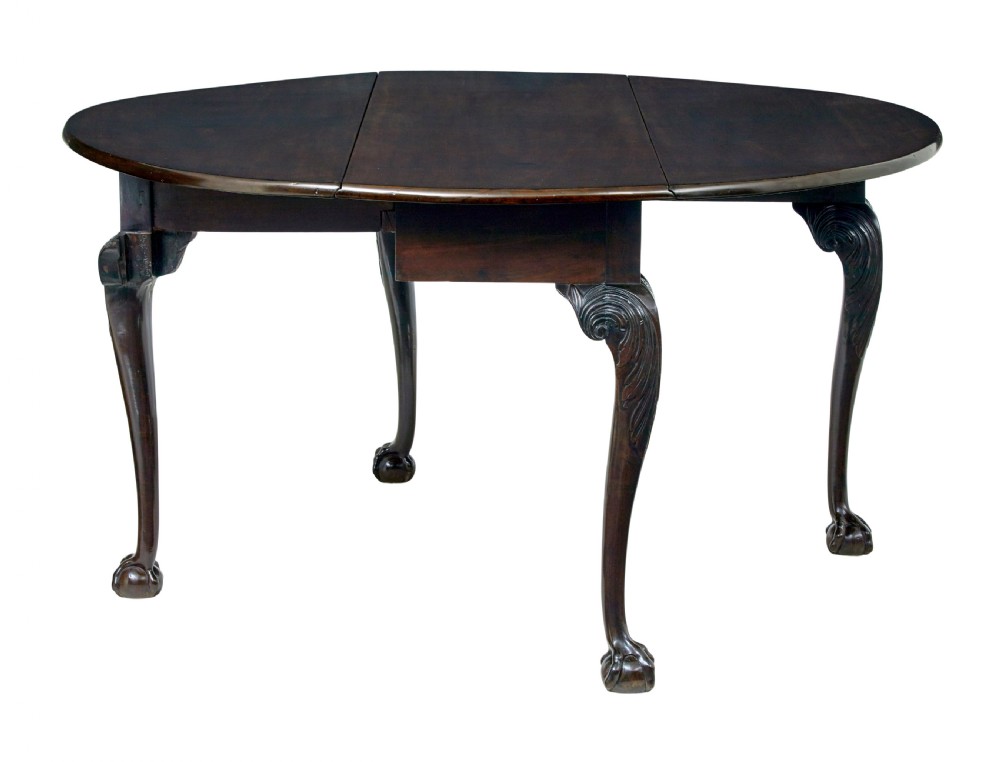 An 18th-century mahogany drop-leaf table featuring hinged oval flaps, cabriole legs with carved acanthus knees, and ball-and-claw feet. View III