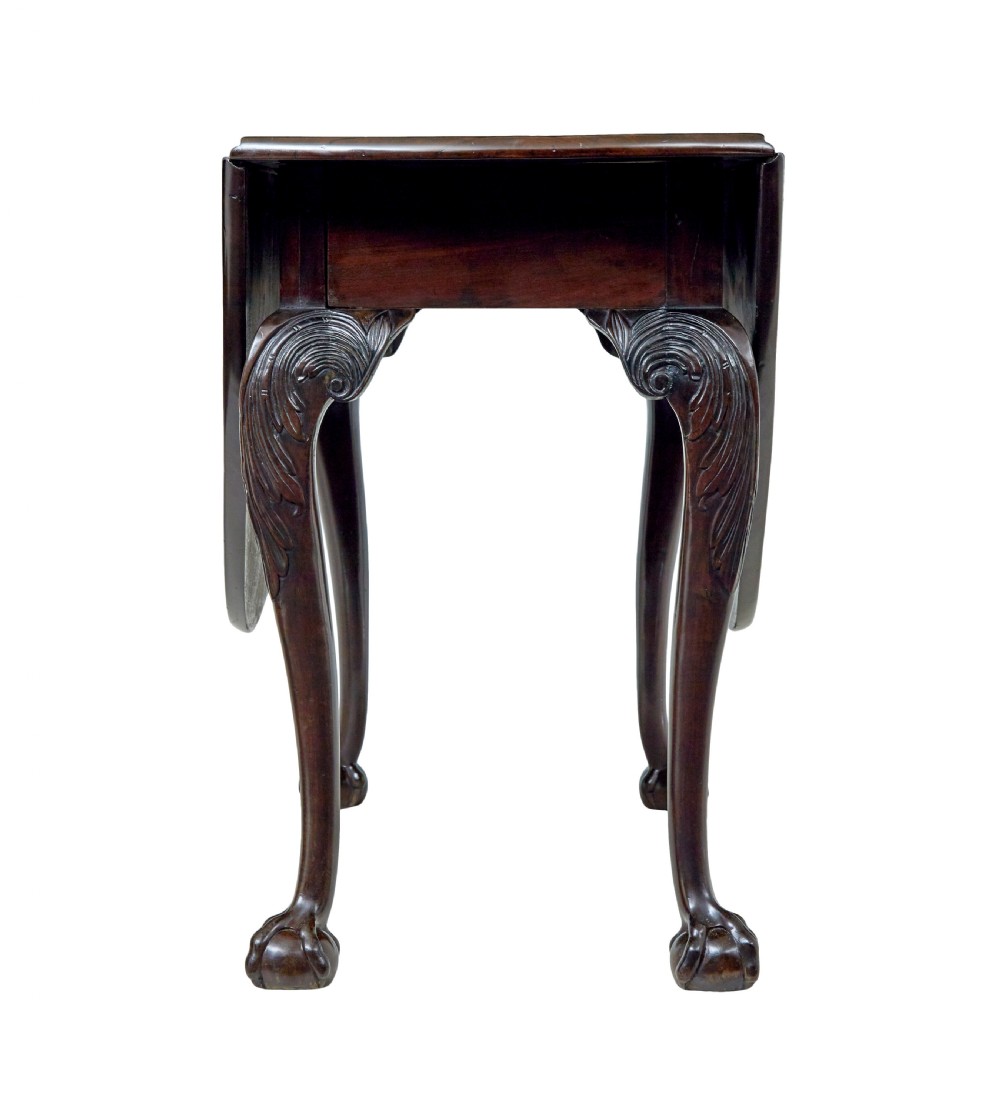An 18th-century mahogany drop-leaf table featuring hinged oval flaps, cabriole legs with carved acanthus knees, and ball-and-claw feet. View VIII