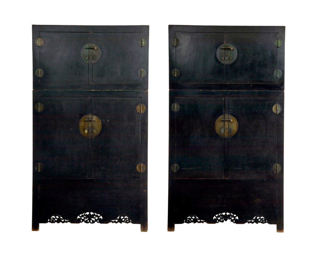 A pair of tall 19th-century black lacquered Chinese compound cabinets featuring circular brass lockplates and carved apron bases. View II