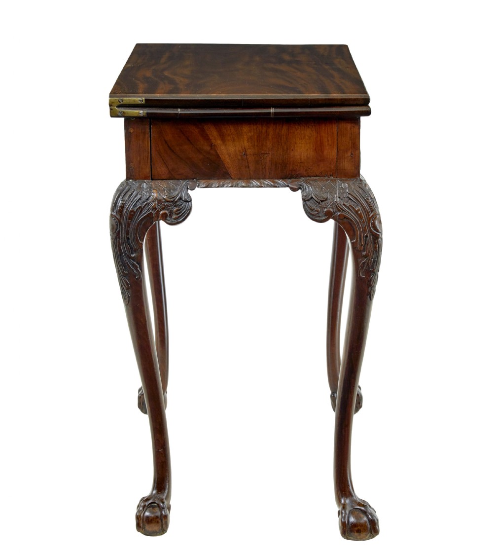 A 19th-century dark mahogany Chippendale Revival fold-over games table shown partially open, featuring carved cabriole legs and claw and ball feet. View IV
