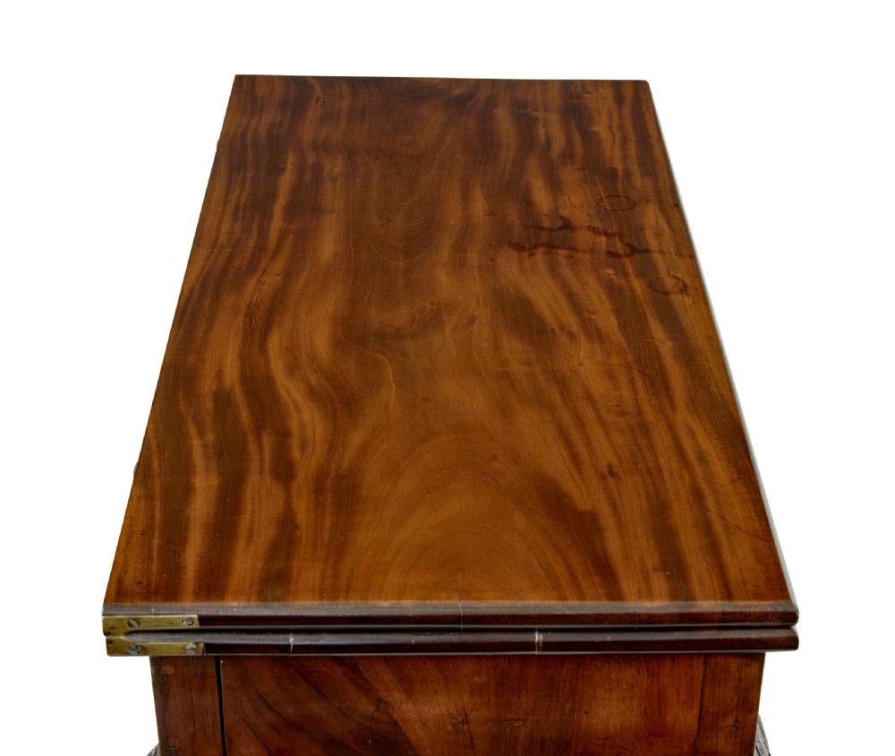 A 19th-century dark mahogany Chippendale Revival fold-over games table shown partially open, featuring carved cabriole legs and claw and ball feet. View V