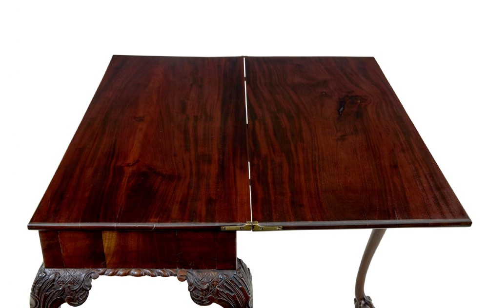 A 19th-century dark mahogany Chippendale Revival fold-over games table shown partially open, featuring carved cabriole legs and claw and ball feet. View VII