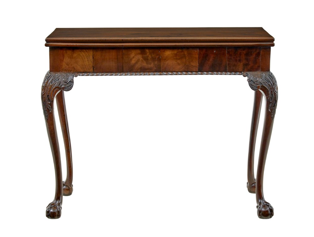 A 19th-century dark mahogany Chippendale Revival fold-over games table shown partially open, featuring carved cabriole legs and claw and ball feet. View IX
