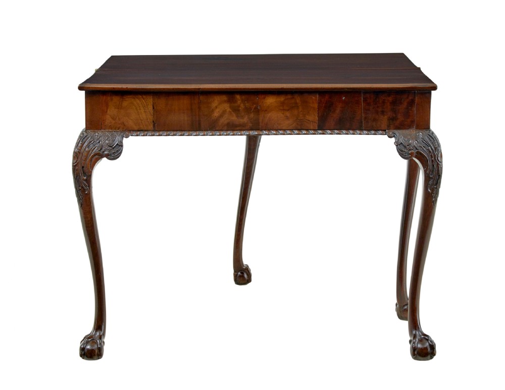 A 19th-century dark mahogany Chippendale Revival fold-over games table shown partially open, featuring carved cabriole legs and claw and ball feet. View X