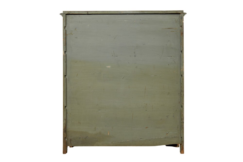 A nineteenth-century Swedish satin birch cupboard featuring two panelled doors with keyhole escutcheons and a shaped scalloped apron base. View VI
