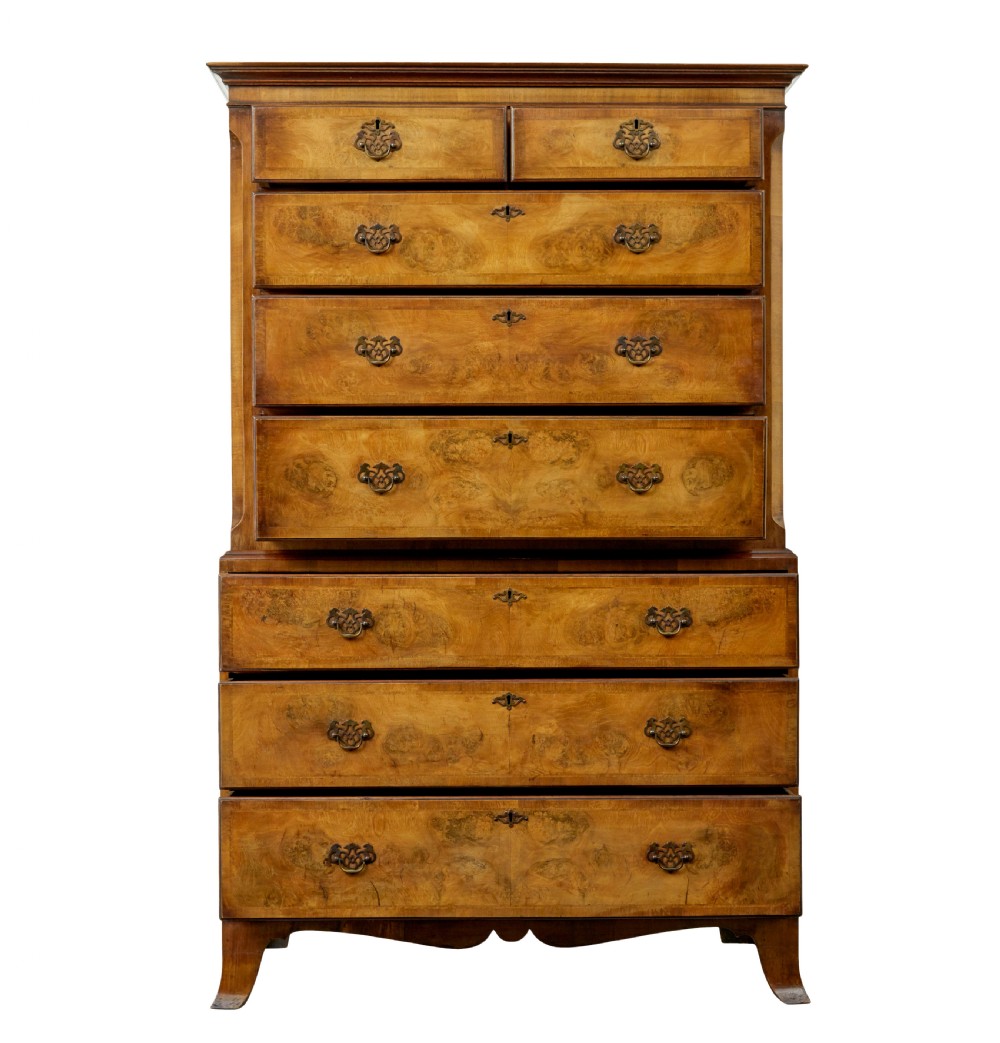 A two-section Late Georgian walnut chest on chest featuring figured timber veneers, brass drop handles, and bracket feet. View III