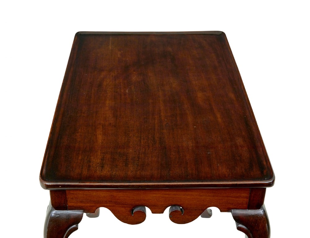 A dark mahogany Georgian-style silver table featuring cabriole legs with pad feet, a tray top edge, and a shell carved motif on the apron. View II