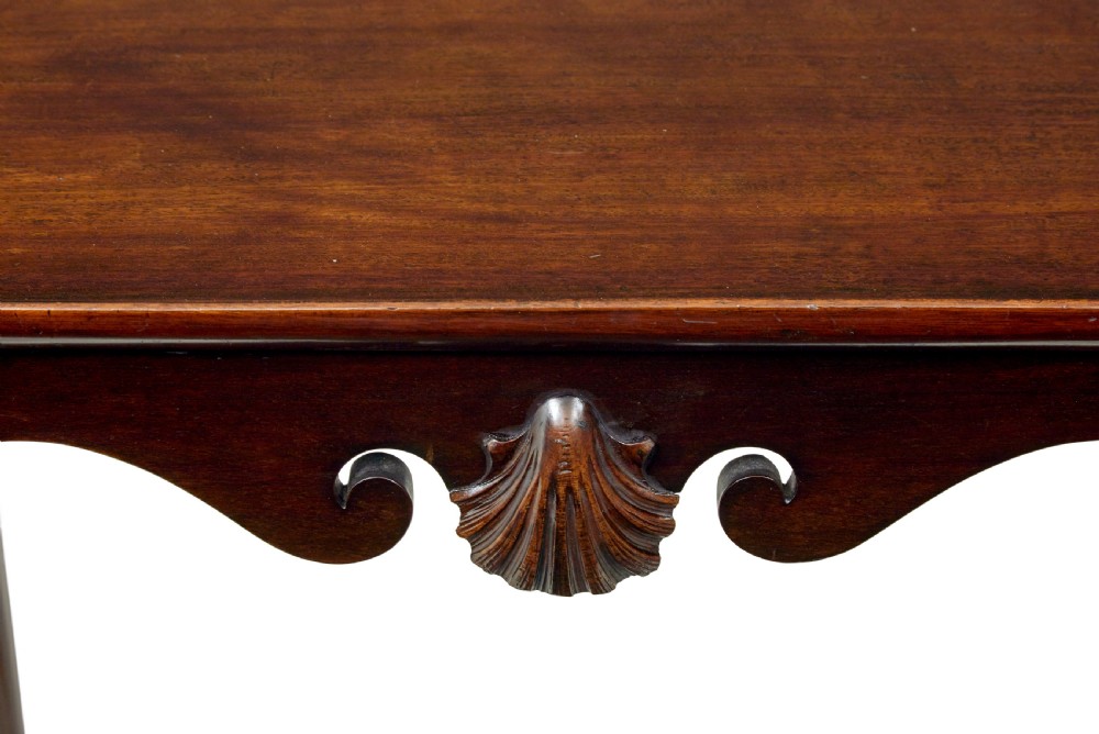 A dark mahogany Georgian-style silver table featuring cabriole legs with pad feet, a tray top edge, and a shell carved motif on the apron. View IV