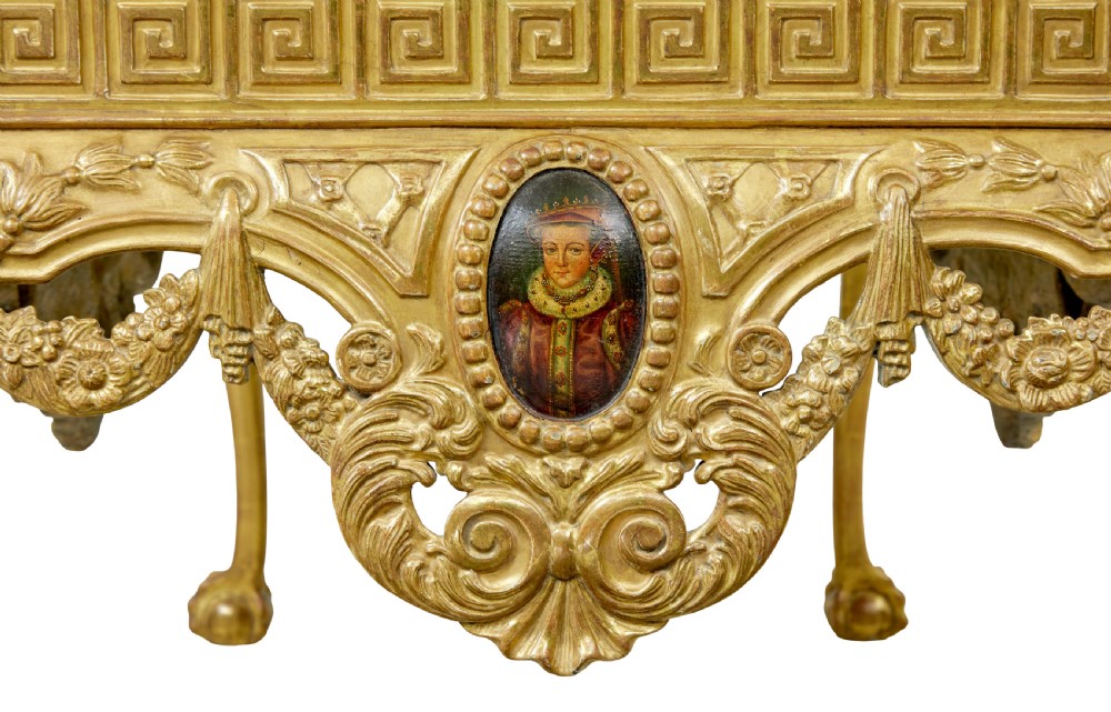 A 19th-century George II style giltwood centre table featuring a green marble top, Greek key frieze, carved swags, and cabriole legs ending in ball and claw feet. View X