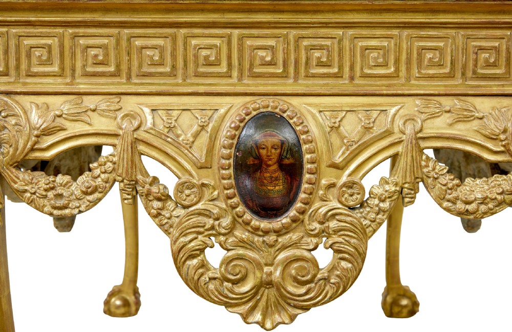 A 19th-century George II style giltwood centre table featuring a green marble top, Greek key frieze, carved swags, and cabriole legs ending in ball and claw feet. View XII