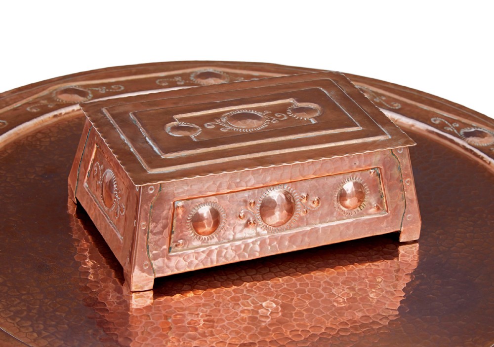 A late 19th-century Arts and Crafts circular oak occasional table featuring a central inset hammered copper tray top and a lower circular tier. View VI