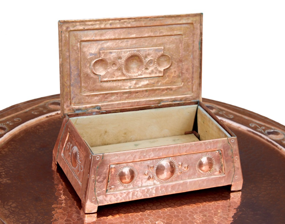 A late 19th-century Arts and Crafts circular oak occasional table featuring a central inset hammered copper tray top and a lower circular tier. View VII
