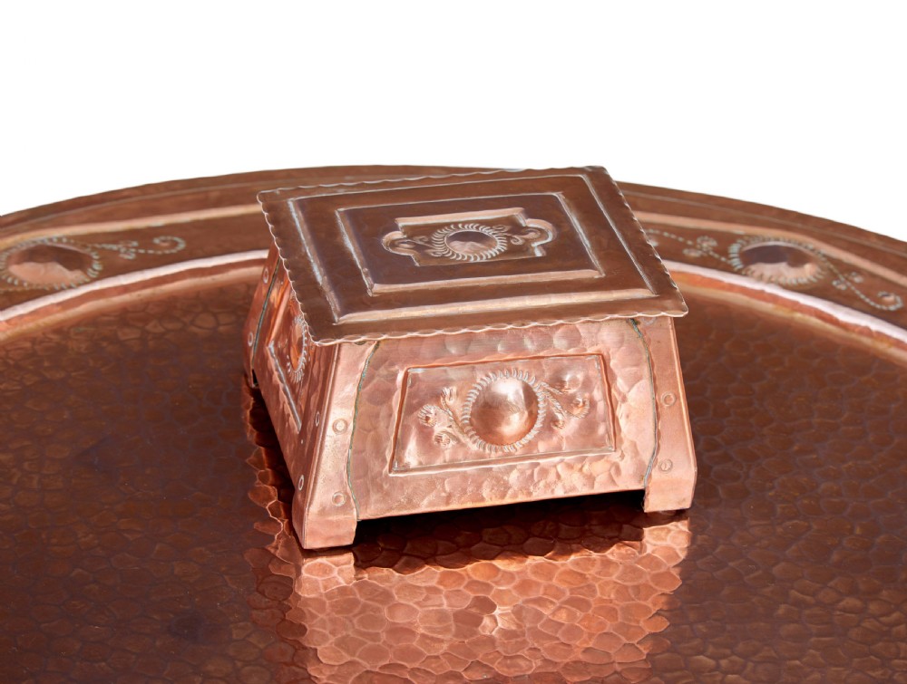 A late 19th-century Arts and Crafts circular oak occasional table featuring a central inset hammered copper tray top and a lower circular tier. View VIII