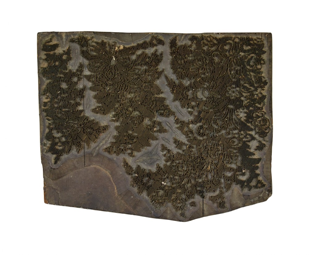 A collection of ten square and rectangular hand-carved wooden textile printing blocks featuring intricate brass wire and pin patterns. View IV