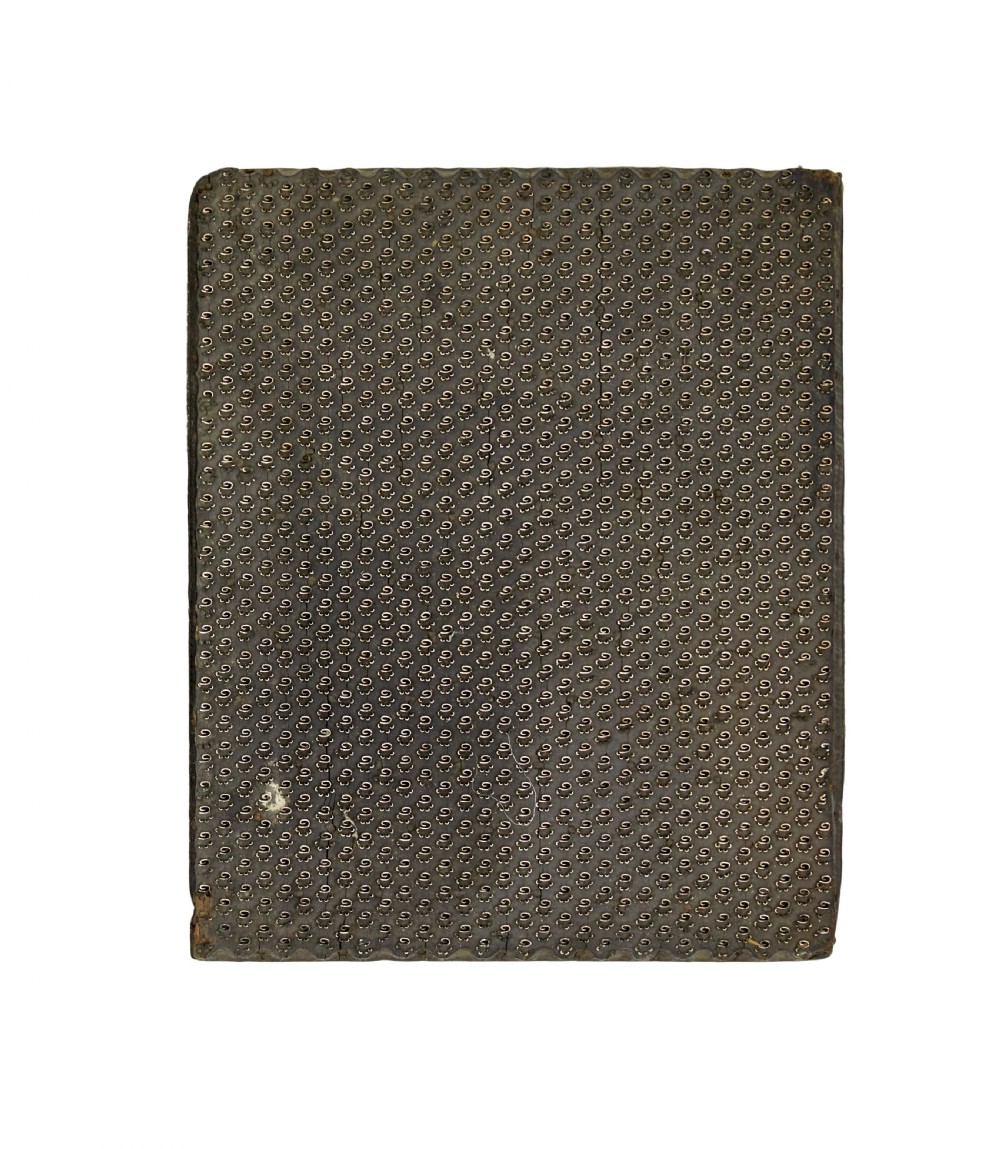A collection of ten square and rectangular hand-carved wooden textile printing blocks featuring intricate brass wire and pin patterns. View VIII