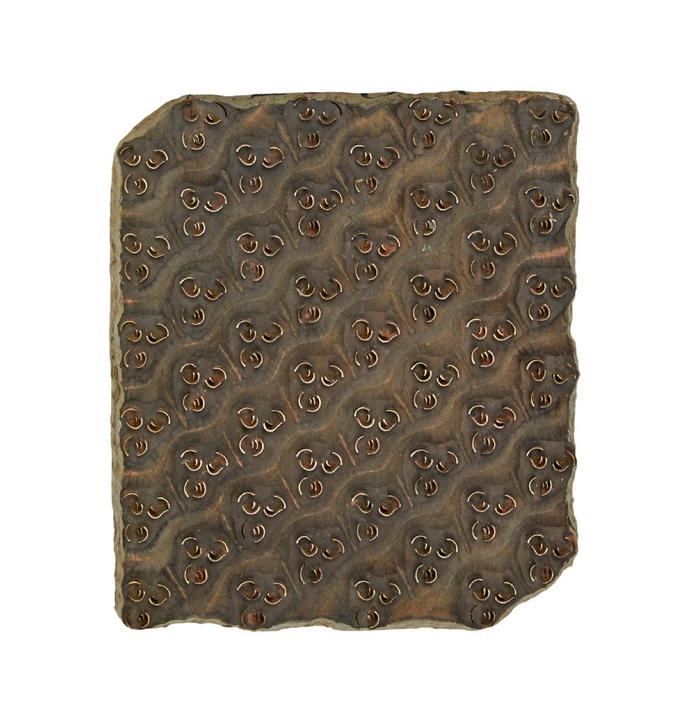 A collection of ten square and rectangular hand-carved wooden textile printing blocks featuring intricate brass wire and pin patterns. View X