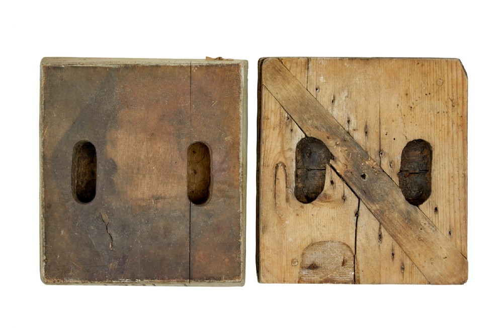 A collection of ten square and rectangular hand-carved wooden textile printing blocks featuring intricate brass wire and pin patterns. View XV