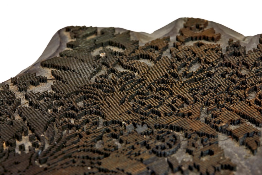 A collection of ten square and rectangular hand-carved wooden textile printing blocks featuring intricate brass wire and pin patterns. View XIX