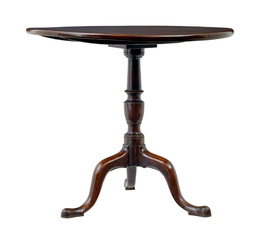 A circular dark mahogany Georgian tripod table featuring a turned central column and three cabriole legs with pad feet. View II
