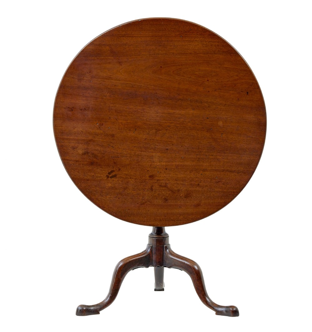A circular dark mahogany Georgian tripod table featuring a turned central column and three cabriole legs with pad feet. View IV