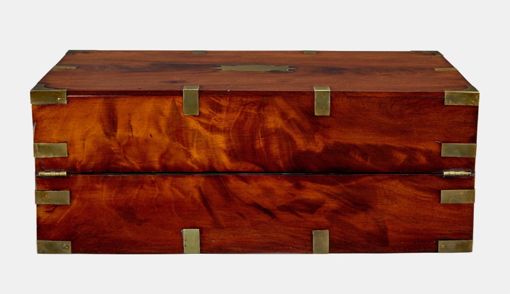 A mid-19th century mahogany campaign writing slope with protective brass-bound corners, a brass keyhole escutcheon, and flush side handles. View III