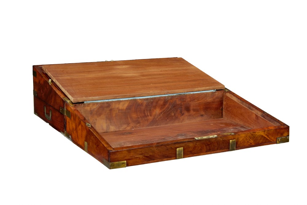 A mid-19th century mahogany campaign writing slope with protective brass-bound corners, a brass keyhole escutcheon, and flush side handles. View VII