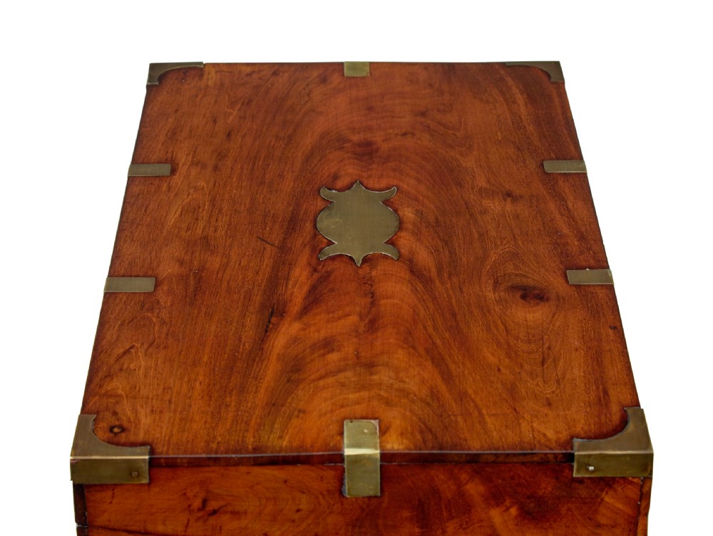 A mid-19th century mahogany campaign writing slope with protective brass-bound corners, a brass keyhole escutcheon, and flush side handles. View X