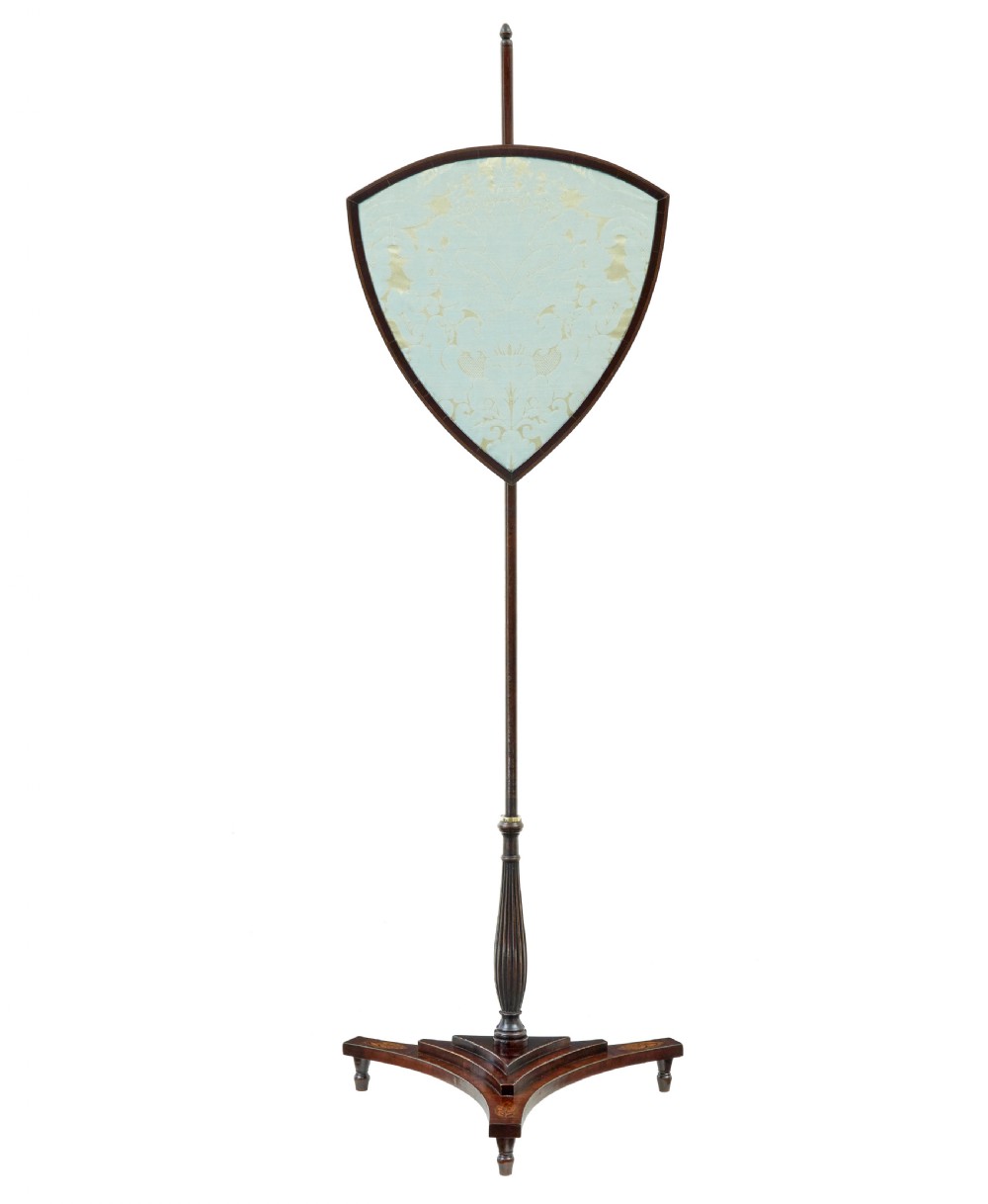 A 19th-century mahogany tripod pole screen featuring an adjustable shield-shaped light blue damask silk panel and an inlaid pedestal base.