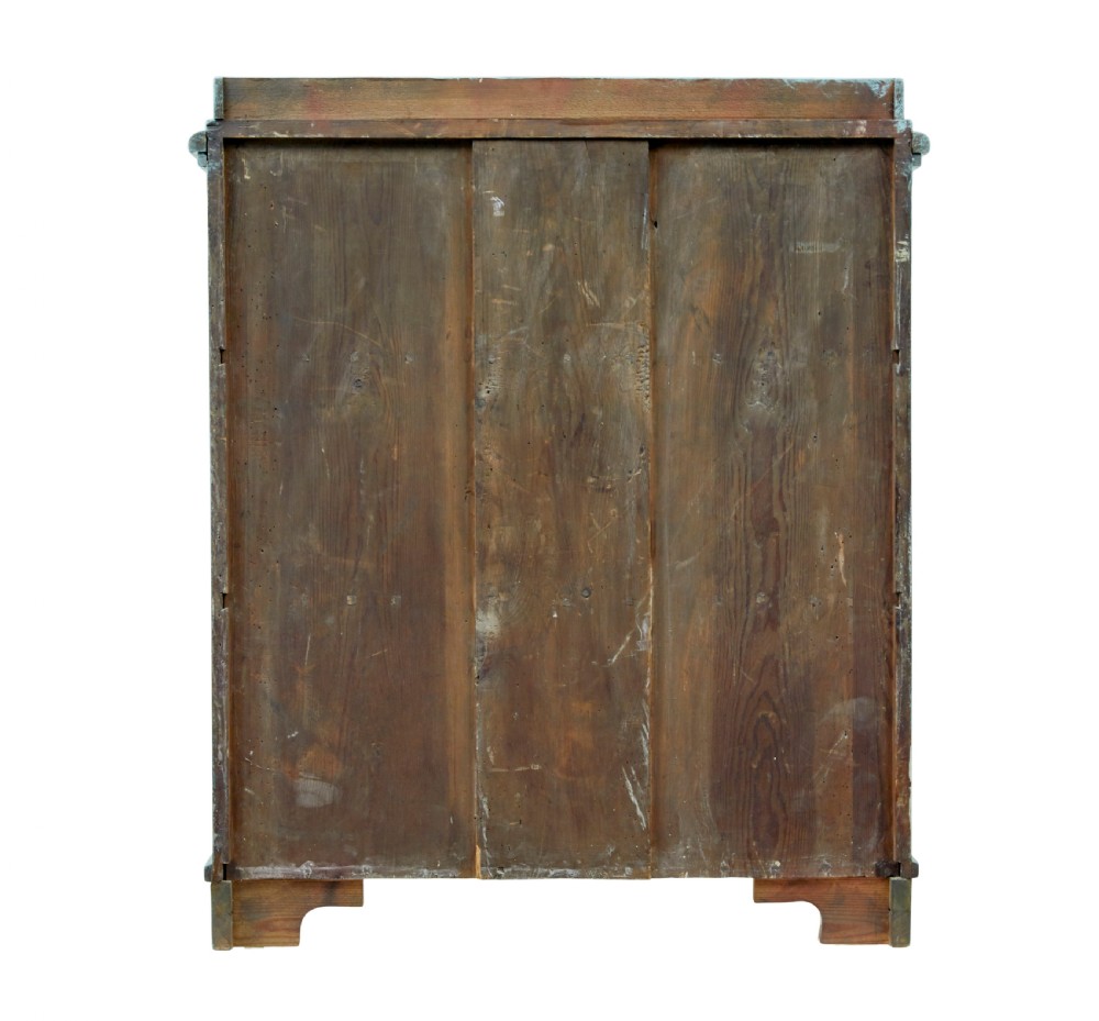 A 19th-century Scandinavian pine double-door cupboard with a distressed light blue painted finish, dentil moulding along the top, and cut-out bracket feet. View VIII