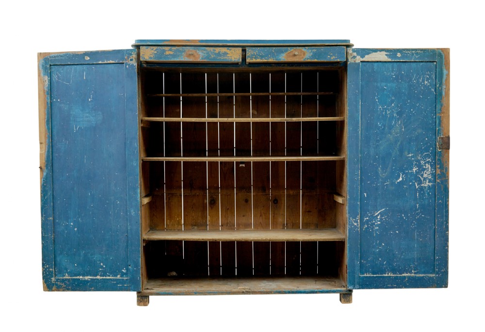A mid-19th-century Scandinavian pine cupboard featuring distressed blue paint, two panelled doors with painted floral motifs, and short block feet. View III