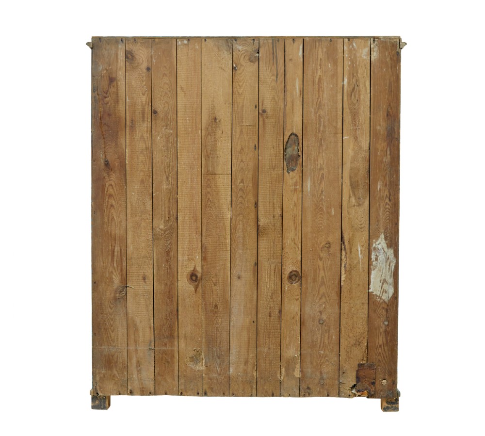 A mid-19th-century Scandinavian pine cupboard featuring distressed blue paint, two panelled doors with painted floral motifs, and short block feet. View V