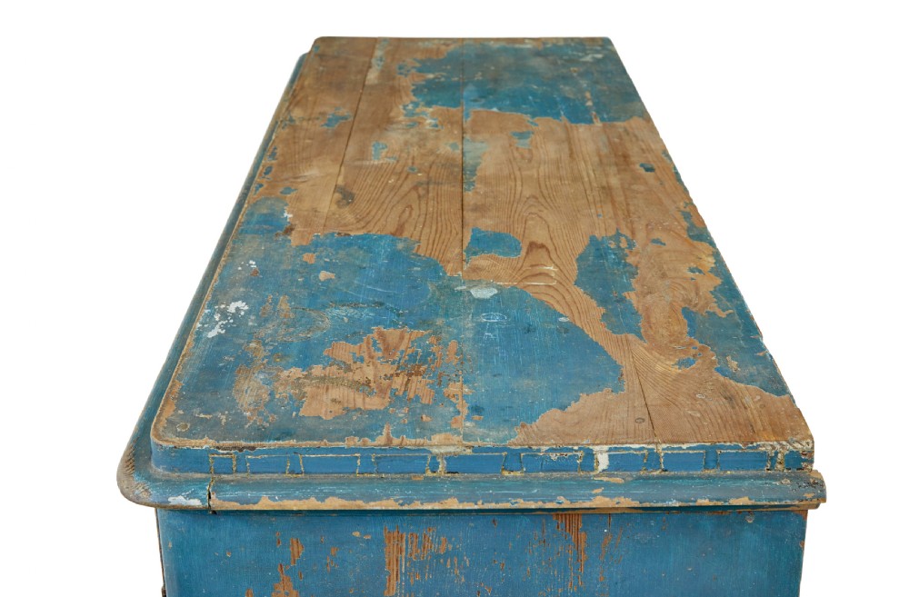 A mid-19th-century Scandinavian pine cupboard featuring distressed blue paint, two panelled doors with painted floral motifs, and short block feet. View XII
