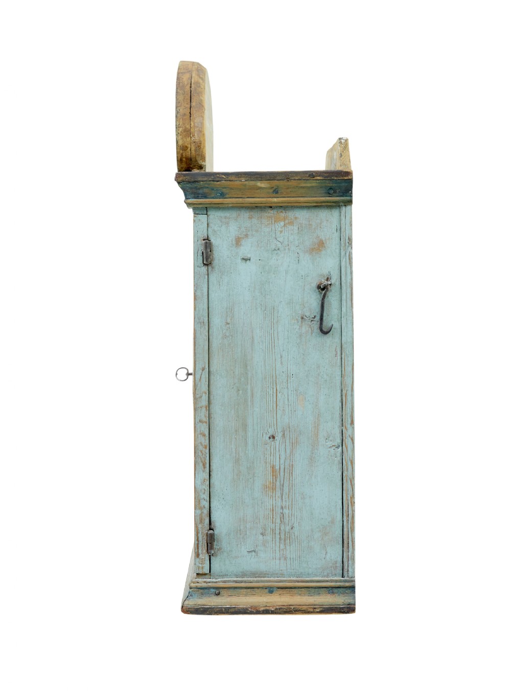 A 19th-century Finnish painted pine wall cupboard featuring weathered light blue paint, an arched pediment crest, and a door panel carved with a diamond pattern. View IV